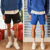 Amerikanska korta män men knä basketbyxor som kör andas mesh träning byxor fuktig wicking svett snabb torkning fitness shorts man