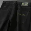 Jeans stretch Designer pour hommes Lettre noire Monster Eyes Stretch Brand Luxury Trend marque pantalons de moto pantalons décontractés