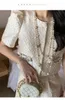 Платье с двумя частями белые женские оборки 2 куска элегантная элегантная элегантная брюки костюмы летние повседневные блузки блузки блузки эластичные талию наряды Femal 2023