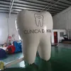 Palloncino modello dente gonfiabile personalizzato Big Stand con personalizzazione per la promozione pubblicitaria del dentista