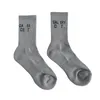 Chaussettes en coton multicolores de marque de mode pour hommes et femmes correspondant à des bas respirants à lettre classique Chaussettes de sport de basket-ball de football mixte