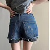 Kvinnors shorts kvinnors byxor visar ben lapptäcke med trasig koppar päl kant hög midja denim breda byxor trend