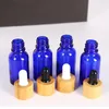 Bottiglie di stoccaggio 25pcs 15ml Flacone contagocce vuoto Fiala di olio essenziale di vetro blu Fiala di bambù liquido Massaggio a goccia Pipetta riutilizzabile