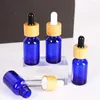 Bottiglie di stoccaggio 25pcs 15ml Flacone contagocce vuoto Fiala di olio essenziale di vetro blu Fiala di bambù liquido Massaggio a goccia Pipetta riutilizzabile