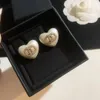 Lyxdesigner mode hjärtformad knutörhängen vit harts akryl 925 silvernål örhänge för kvinnor fest födelsedagspresent smycken hög kvalitet med låda