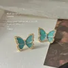 Pendientes de tuerca para mujer, novedad de 2023, mariposa azul sencilla y dulce, regalos de joyería de Metal esmaltados a la moda