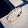 Bracciale rigido in acciaio al titanio ceramica bianca con zirconi cubici rivetto polsino per donna gioielli da sposa festa di ballo placcato oro Melv22