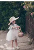 Chapéus Crianças tricotadas à mão Ráfia Retrô Flat Top Sol Meninas e Meninos Viagem de Verão Protetor Solar Férias Chapéu de Palha com Laço
