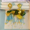 Pendientes de botón Borla larga Cuentas de flores chapadas en oro Oreja de moda bohemia