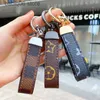 Keychains 2021 Luxury Men'S Waist Buckle Leather Presbyopia Keychain Pendant Car Key Chain Ring Fashion Couple Creative Gift T230625