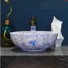 Lavabo en céramique bleu et blanc en porcelaine de Chine lavabo fait à la main en céramique Lavobo Round Countertop salle de bains en céramique sinkgood qté Aflro