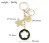 Nyckelringar Vackra fem-blåsiga nyckel Keychain Utsökt metall modebilhänge Key Ring Women's Bag Charm Gift