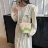 틈새 디자인 밀짚 짠 가방 여성 크로스 바디 가방 휴대용 꽃 양동이 가방