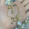 Elegante pulsera de oso con dije de cristal de oro de 18 quilates, brazalete de cadena, diseño de marca de lujo, colgante de letra para mujer, pulsera de flor de trébol, accesorios de joyería para fiesta de boda, regalo