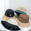 Berretti 2023 Colore a contrasto Primavera Estate Cappello a secchiello semplice Trendy Lettera C Pescatore ricamato Viaggio Sole a prova di sole per le donne