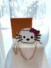 Nouvelle mode femmes porte-monnaie Designer couleur lettre stockage portefeuille poche mignon chat dessin animé dames pochette avec chaîne peut être sacs à bandoulière Totes pendentif à breloques