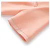 2023 été rose couleur unie robe à manches courtes col en v genou longueur robes décontractées W3L043904