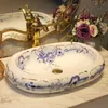 China Artistic Handmade porcelain wash basin Round bathroom counter top ceramic Bathroom basin sink oval chinese wash basin Tsqpi