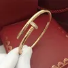 Designer charm Hot selling minimalist personality trend men and women's fashion nail bracelet crossing 18K gold light luxury opening couple jewelry woman