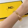 18% de réduction sur le bracelet tendance de la chaîne d'extension en laiton ouvert avec lettre de famille F