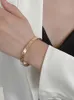 Charme de créateur Bracelet en acier en titane en or rose pour la série d'insen pour femmes Sen High Grade Inlaid incolore et simple artisanat simple