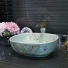 Peinture artistique Fleurs oiseau Porcelaine Art Comptoir Washnasin Céramique Salle De Bains Vasque Lavabos Vanités lavabo chinois ovale Dudqi