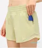 Tenue de yoga femmes contrôle du ventre Shorts de yoga pour femmes entraînement course Shorts de sport poche à fermeture éclair latérale léger respirant court