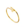 Designer charm Hot selling minimalist personality trend men and women's fashion nail bracelet crossing 18K gold light luxury opening couple jewelry woman