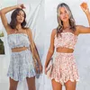 Survêtements pour femmes 2023 été femmes deux pièces ensembles Boho jupes florales ensemble dames poitrine Wrap dos nu haut court et taille haute Mini jupe