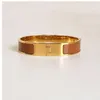 Bracelete de ouro clássico esmaltado de 12 mm de largura Pulseiras de aço de titânio com design de marca de luxo para joias masculinas e femininas (versão baixa)