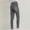 Damskie dżinsy jasnoniebieskie rozryte dla kobiet w stylu ulicznym seksowne nisko wzniesione w trudnej sytuacji spodni chuda dziura dżinsowa ołówek