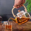 Vattenflaskor Borrey Handle Glass TEAPOT HEATRESISTANT Flower Te Kettle Stor Clear Fruit Juice Container Ceramic Holder Base 230627