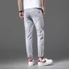 Jeans masculino designer de alta qualidade jeans masculino primavera 2022 nova tendência de moda simples versátil elástico ajuste fino calças retas de perna pequena HOSR