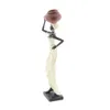 Figurine di oggetti decorativi 16 "H 4" W Scultura di donna africana in piedi in polystone color crema con vasi d'acqua rossi e base nera di DecMode 2 Count 230627