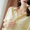 女性用ブラウスソリッドカラーコットンショートスリーブ女性のための白いシャツ夏の韓国スタイルポロネックルーズファッションVネックブラウストップ