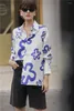 Blouses pour femmes automne irrégulière fleur Graffiti chemise profil revers à manches longues hommes et femmes mode Blouse