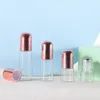 Botellas de rodillos de 1-5 ml para aceites esenciales Rollo de vidrio transparente en vial con bola de metal y tapa de rosa dorada Fpobe