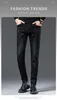 Jeans masculino designer coreano preto cinza jeans moda outono e inverno masculino novíssimo Medusa bordado elástico slim fit calças retas de perna pequena TCOC