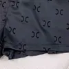 夏のデザイナー女性スポーツショーツホットパンツアイスシルクファブリックボタンアップ付きの薄い低層ブラックスーツショーツ