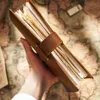 ノートブック高品質の素朴な本物の革リングノートブックA5スパイラルダイアリーブラスバインダージャーナルスケッチブックアジェンダプランナー文房具