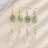 Dangle & Chandelier Hetian jade ring buckle earrings Classical temperament Xiu Wo bride earrings Gold plated double ring white jade peace buckle earrings