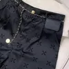 夏のデザイナー女性スポーツショーツホットパンツアイスシルクファブリックボタンアップ付きの薄い低層ブラックスーツショーツ