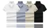 2023 Gömlek Erkekler İçin Tasarımcı Yaz PRA Göğüs Mektup Deseni Tasarımı Sıradan Basit ve Çok Seyir Nefes Alabası Pamuk Kısa Kol Boyutu M-XXXL Lüks Erkekler Çalışma Polo Gömlek