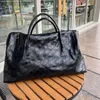 Black Fashion ES Sacs de voyage géants Fourre-tout en cuir matelassé Maxi Sac souple Poignées supérieures duffle designer femmes hommes Zip Closure Case grands sacs à main 56cm