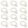 チャームブレスレット12 PCS DE BAUTIZO ROSE BRACELET Religious Cross Pearl Baby Shower favors Quince Party Handmade Beads