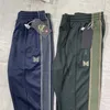 Pantaloni da uomo Verde nerastro Pantaloni con aghi AWGE Uomo Donna 1 1 Pantaloni con aghi a farfalla ricamati di qualità Pantaloni classici a righe 230628