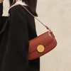 Bolsos de noche 2023 estilo primavera bolso de hombro de cuero rojo con hebilla magnética bolsos de lujo para mujeres uso diario y salidas informales