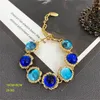 Orecchini a bottone Collana di fiori di vetro blu Bracciale Bracciale in argento Set di gioielli di temperamento di moda Accessori per abiti da banchetto da donna