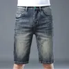 Men's Jeans designer Summer casual jeans, men's slim fitting cotton stretch shorts with small feet, Korean version of high-end European style big cow pants, capris 0IDI