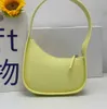 The Row Sac Demi-Lune En Cuir Lisse Designer Femme Avec Bandoulière Plate Et Fermeture Éclair Courbée Embrayage Fourre-tout Suded Premium Niche high sense